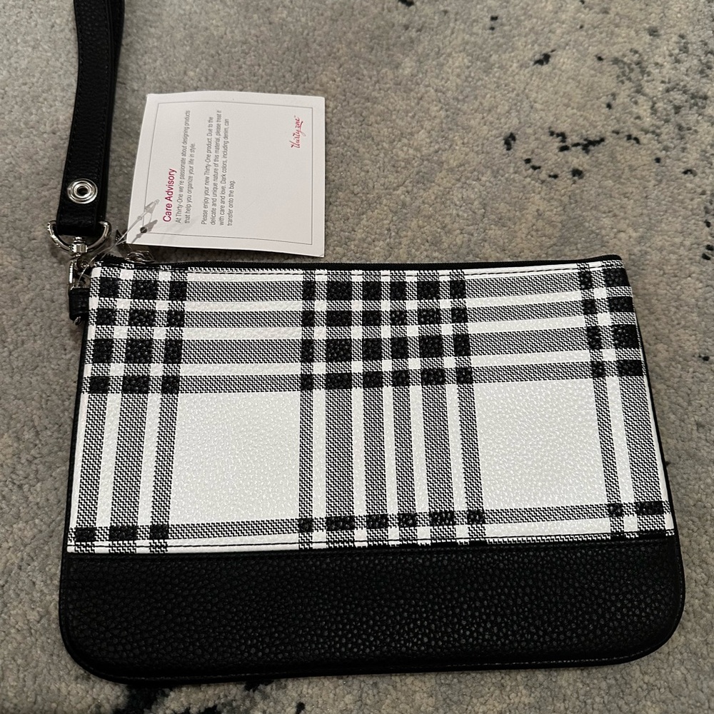 Thirty One Gifts Leather wristlet in black and white plaid.